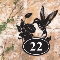 Hummingbird Iron House Number Sign in Situ on a Rustic Wall 