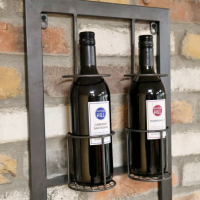 Wine Bottles Being Held at the Top of the Wine Rack