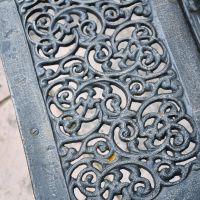 Close up of decorative scroll design on seat 