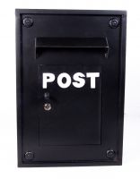 Black Kensington post box with white letters