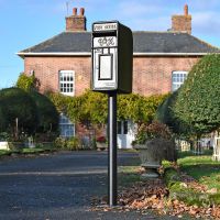 King George Rex Black Period Post Box in Situ in the Front Garden