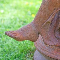 Close up of Cast Iron Greek Lady"s foot