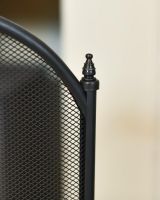 Close Up Of Large Black Four Fold Fire Guard Finials