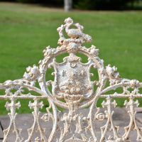 Close up of Central Gothic Motif on Antique Cream Cast Iron Garden Bench
