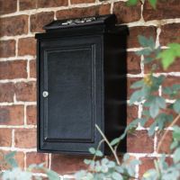 Simplistic Post box on brick wall