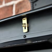 Close up of polished brass latch 