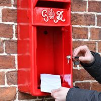 Close up of Redford Keep King George Post Box with Door Open 