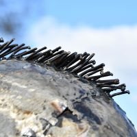 Close-up of the Recycled Metal Finish Leaping Leopard Sculpture