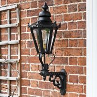 Black traditional porch lantern on brick wall
