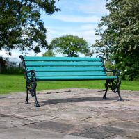 Ornate Green Cast Iron Garden Bench on Patio