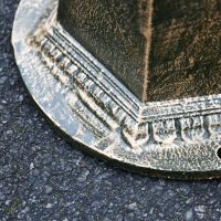 Close up of circular base with pre-drilled holes 