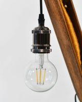Close up of Yellow Loom Bobbin Table Lamp Bulb