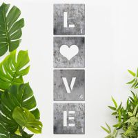 "LOVE" Scrabble Square Letters on a Cream Wall