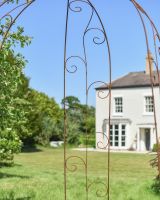 Close up of intricate scrollwork on garden gazebo