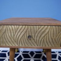 Close-Up of Brass Cladding on Mango Wood Beside Cabinet