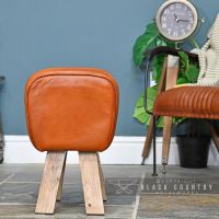 Side View of the Mango Wood & Tan Goat Leather Bug Stool Sitting in the House