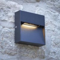 Contemporary Square "Eyelid" Light in Situ on Stone Wall