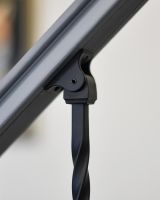 Close-up of the Adjustable Stair Spindle Bracket Attached to the Handrail