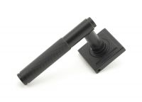 Matte Black Textured Unsprung Lever Door Handle on Square Rose