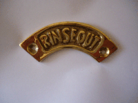 Curved cast brass sign "rinse out"