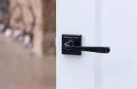 Midnight Black Lever Door Handle on Square Rose on Door