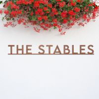 Minimalist Rustic House Name Sign under flowers