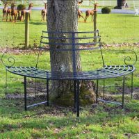 Black "Monmouthshire" Wrought Iron Deluxe Tree Seat in Situ by a TRee in the Garden