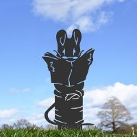 Black Mouse Sitting on Cotton Spindle Silhouette in Situ