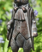 Close up of intricate clothes detail on rabbit garden statue