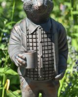 Close up of well dressed rat garden sculpture