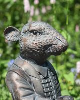 Close up of rat garden statue