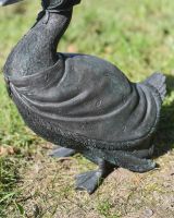 Close up of clothes detail on garden duck sculpture