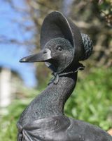 Close up of face detail on resin duck garden statue