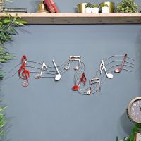 Musical Metal Wall Art Sign in Situ on a Blue Wall