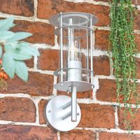 "Naltio" Contemporary Silver Wall Light on Brick Wall