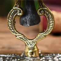 Close up of cast iron pendant
