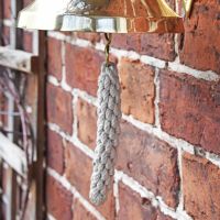 Polished Brass Bell with Rope Lanyard Close-Up