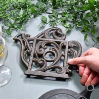 Rustic Kettle Shaped Cast Iron Trivet to Scale