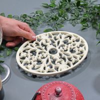 Cream Cast Iron Oval Trivet to Scale