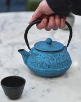 Scale image of "Oketo" Lotus Flower Blue and Black Cast Iron Japanese Style Teapot