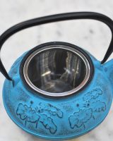 Close up of "Oketo" Lotus Flower Blue and Black Cast Iron Japanese Style Teapot strainer
