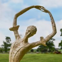 Close up of Rustic Cream Cast Iron Ballet Dancer 