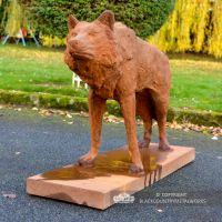 Rustic Cast Iron "Looking Forward" Wolf Sculpture in Situ in the Garden