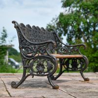 Side view of Ornate design on Cast Iron Aged Black "Serpent" Bench