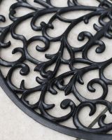 Close-Up of Ornate Cast Iron "Sunrise" Semi Circle Door Mat in Black