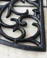 Close-Up of Black Ornate Cast Iron "Sunrise" Semi Circle Door Mat