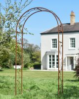 Ornate Floral "Corolla" Rustic Rose Arch in Situ Outside in a Garden