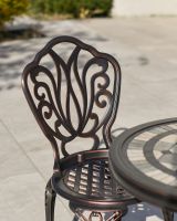 Ornate Pattern on the Back of the Chairs