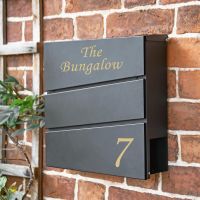 Personalised Black "Park View" Wall Mounted Post Box & Newspaper Holder in situ on a Brick Wall