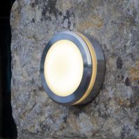 Polished Aluminium Round Wall Light in Situ on a StoneWall